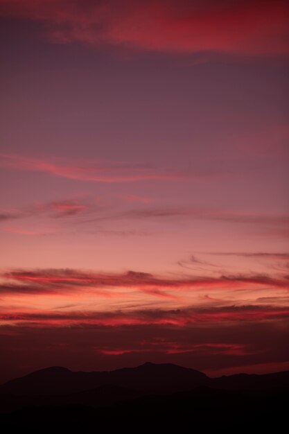 Reddish clouded background on the sky