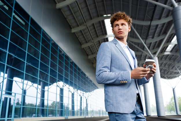 redhaired businessman drinking coffee