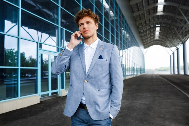 redhaired businessman talking on phone