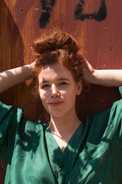 Redhead casual dressed woman looking at camera