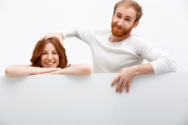 Redhead funny couple lean on table