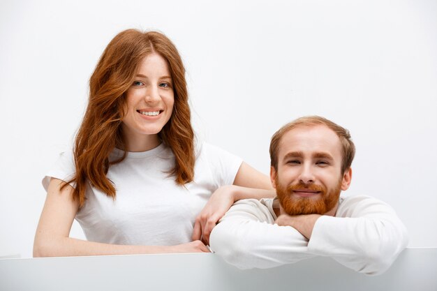 Redhead funny couple lean on table