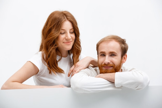 Redhead funny couple lean on table