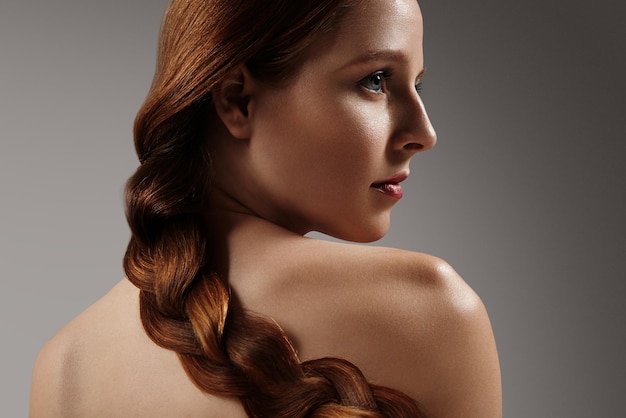 Redhead girl with elegant hairstyle