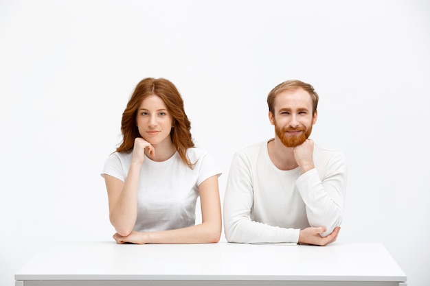 Redhead man and woman look curious