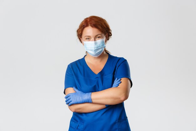 Redhead middle-aged nurse posing