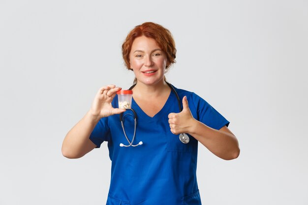 Redhead middle-aged nurse posing