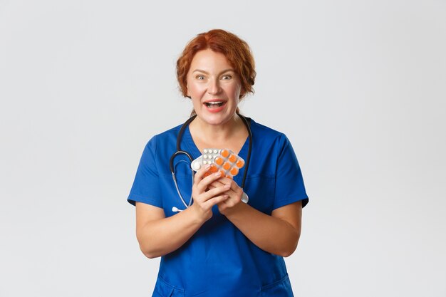 Redhead middle-aged nurse posing