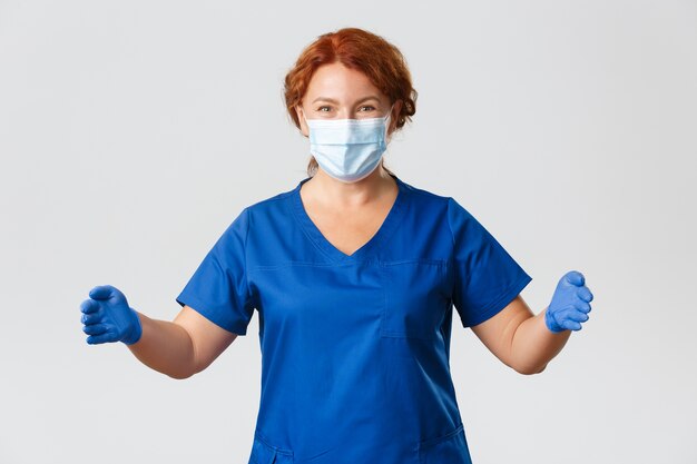 Redhead middle-aged nurse posing