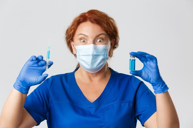 Redhead middle-aged nurse posing