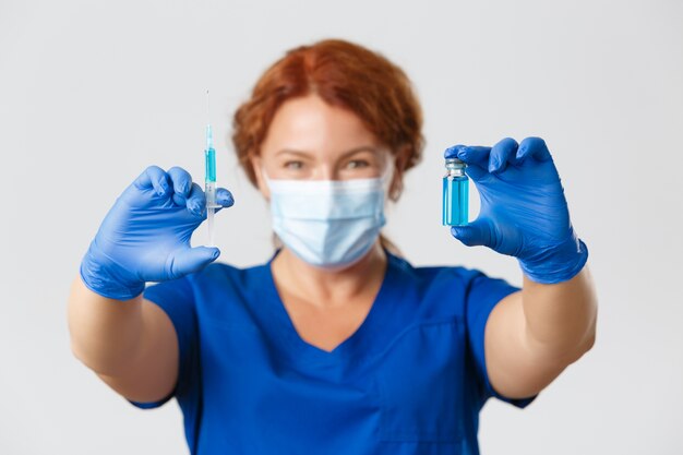 Redhead middle-aged nurse posing