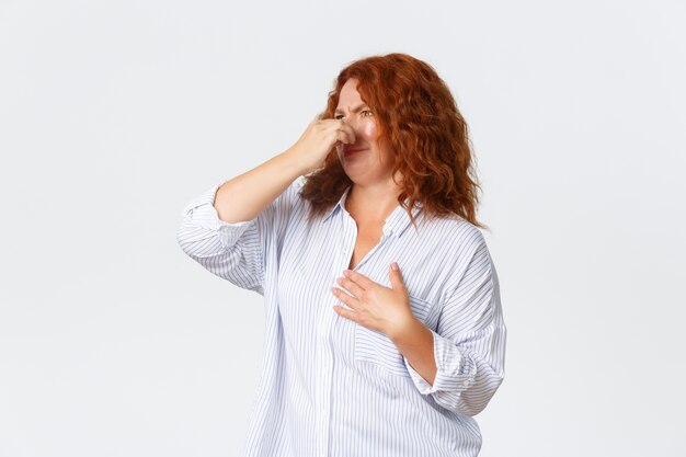 Redhead middle-aged woman posing