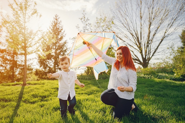  redhead mom in a white blouse playing with her little sweet son i