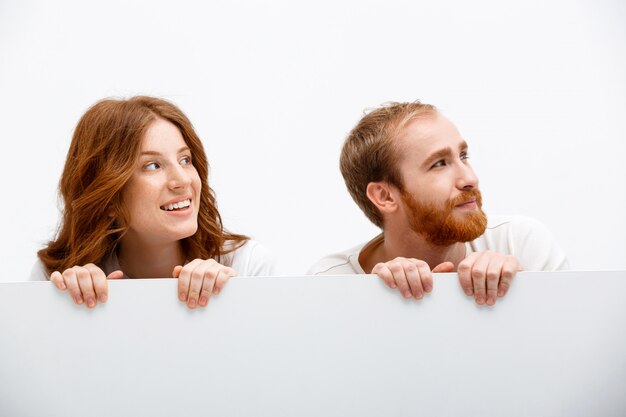 Redhead parents playing hide and seek, look right