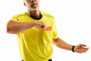 Free photo referee showing a red card and gesturing to a football or soccer player while gaming isolated on white wall. concept of sport, rules violation, controversial issues, obstacles overcoming.