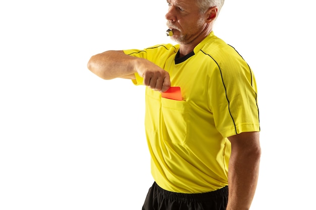 Free photo referee showing a red card and gesturing to a football or soccer player while gaming isolated on white wall.