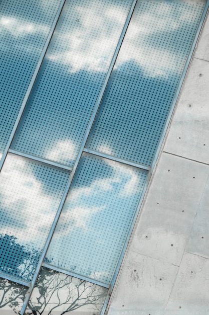 Reflection of a cloudy sky on window