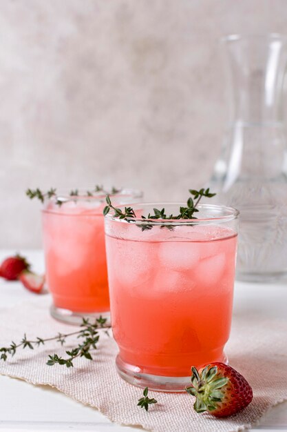 Refreshing alcoholic drinks with strawberries