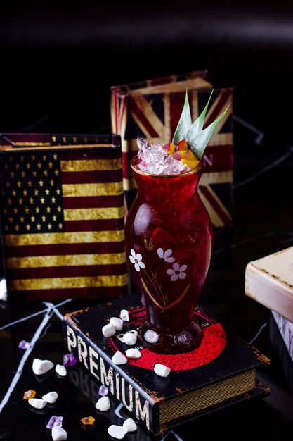 Refreshing cocktail with crushed ice and leaves