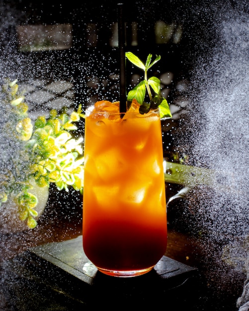 Refreshing cocktail with ice cubes and mint leaves