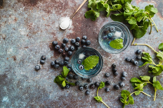 Refreshing cold drinks with blueberries and mint 