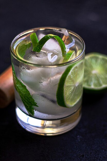 Refreshing drink with lemon slices mint and ice cubes