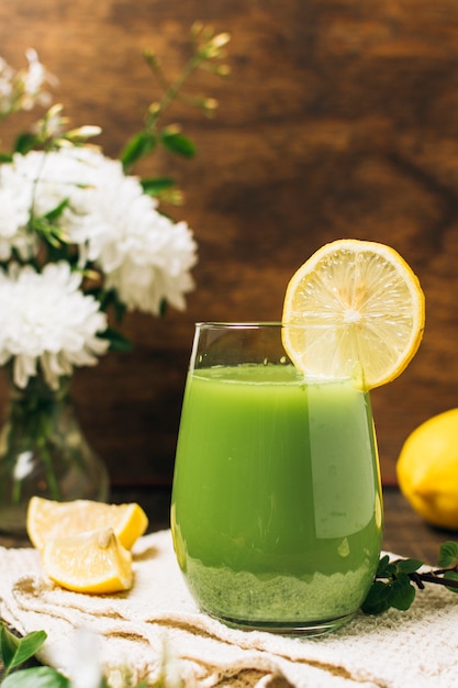 Refreshing green smoothie with lemons