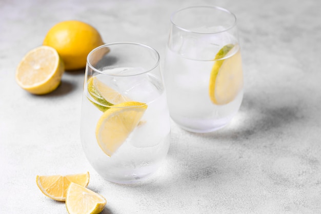 Free photo refreshing lemonades with ice ready to be served