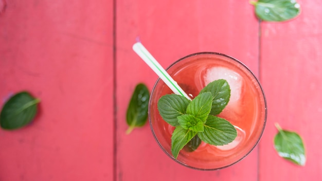 Refreshing red drink with herbs