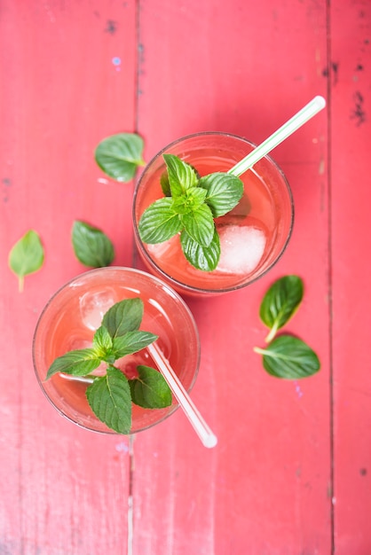 Free photo refreshing red drink with herbs