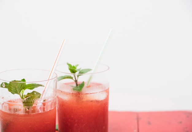 Free photo refreshing red drink with herbs