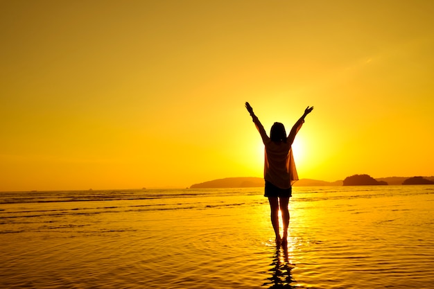 Free photo relax woman  jumping sea on the beach