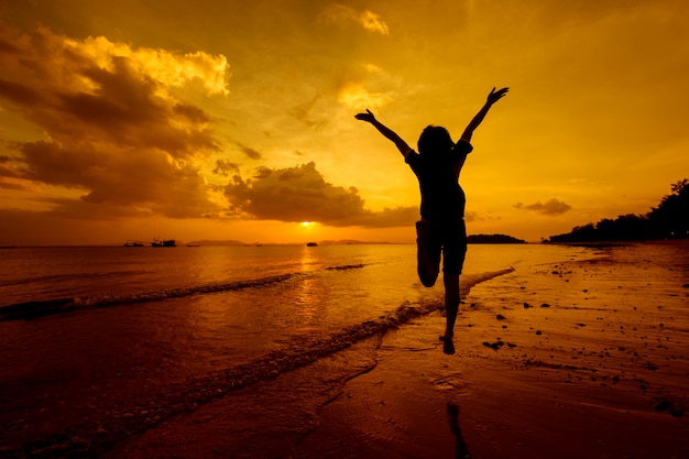 Relax Woman  jumping sea on the beach   