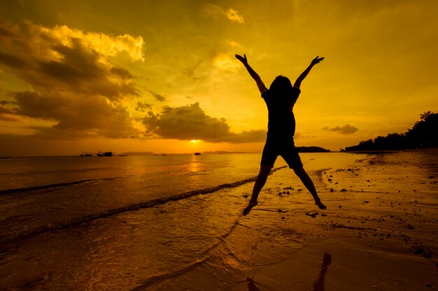 Relax Woman  jumping sea on the beach   