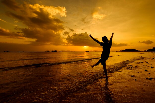 Relax Woman  jumping sea on the beach   