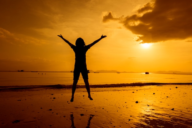 Relax Woman  jumping sea on the beach   