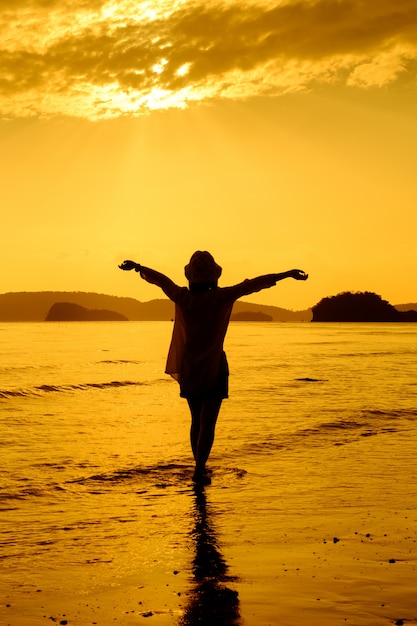 Relax Woman  standing sea on the beach   