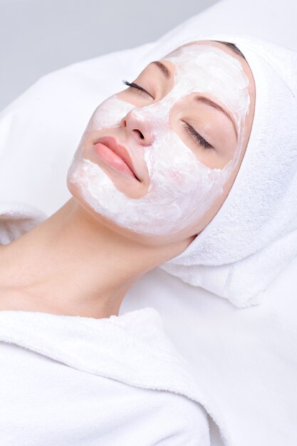 Relaxation of young beautiful girl in the spa salon