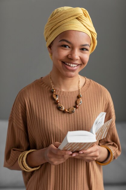 Relaxed arab woman reading a book at home