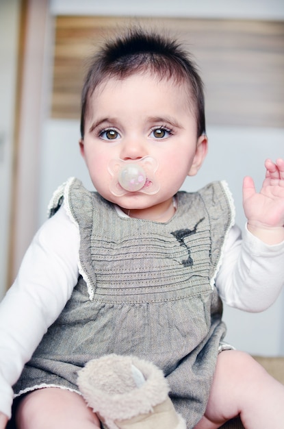 Relaxed baby with a pacifier