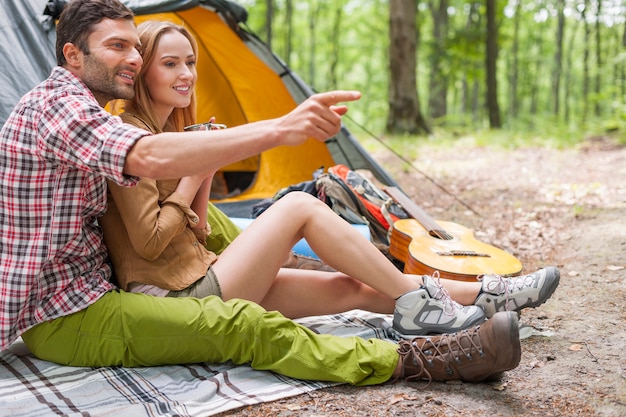 Relaxed couple enjoying in the forest.