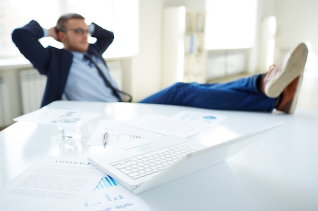 Relaxed executive in his office