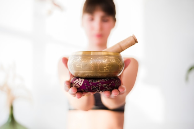 Relaxed girl practicing yoga at home