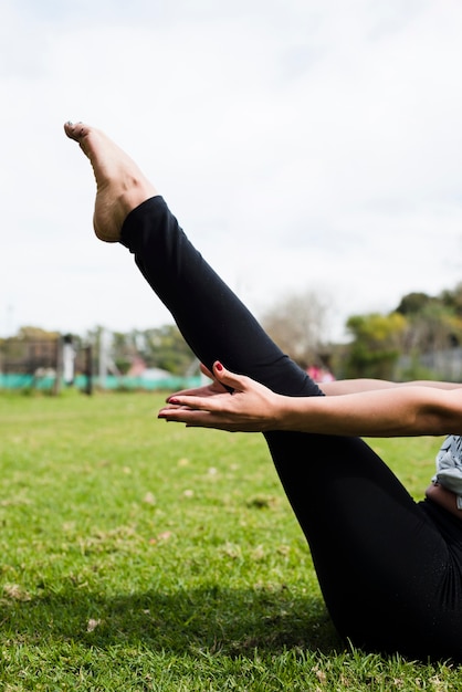 Relaxed girl practicing yoga outdoor