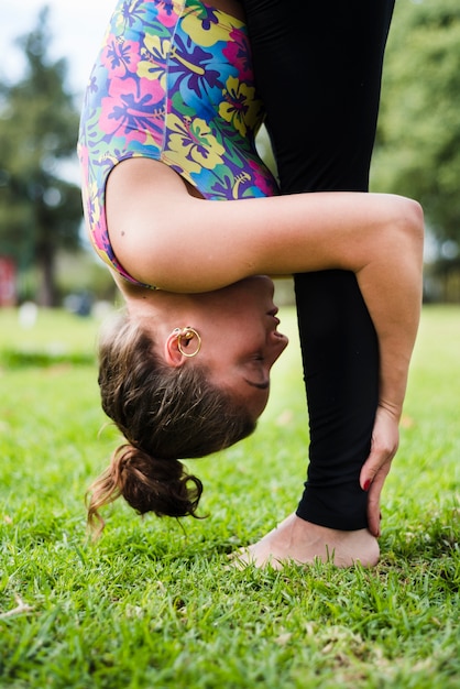 Relaxed girl practicing yoga outdoor