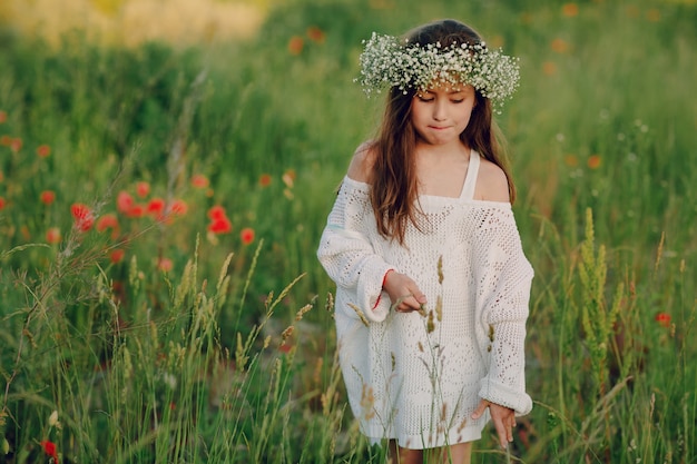 Relaxed girl walking through the meadow