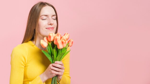 Relaxed girl with flowers