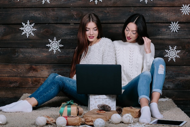 Relaxed girls using a laptop