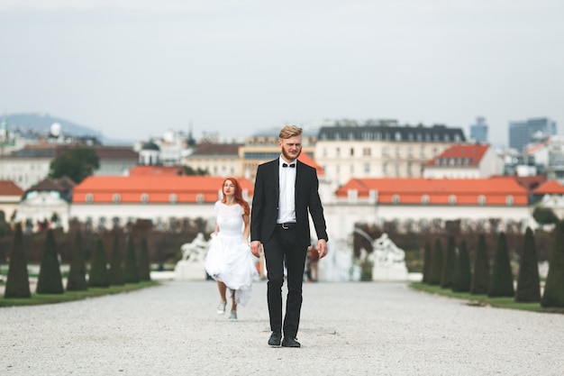 Free photo relaxed groom walking