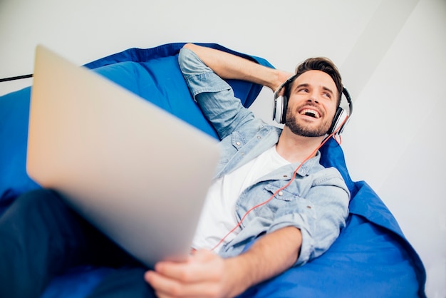 Relaxed handsome guy listening to music